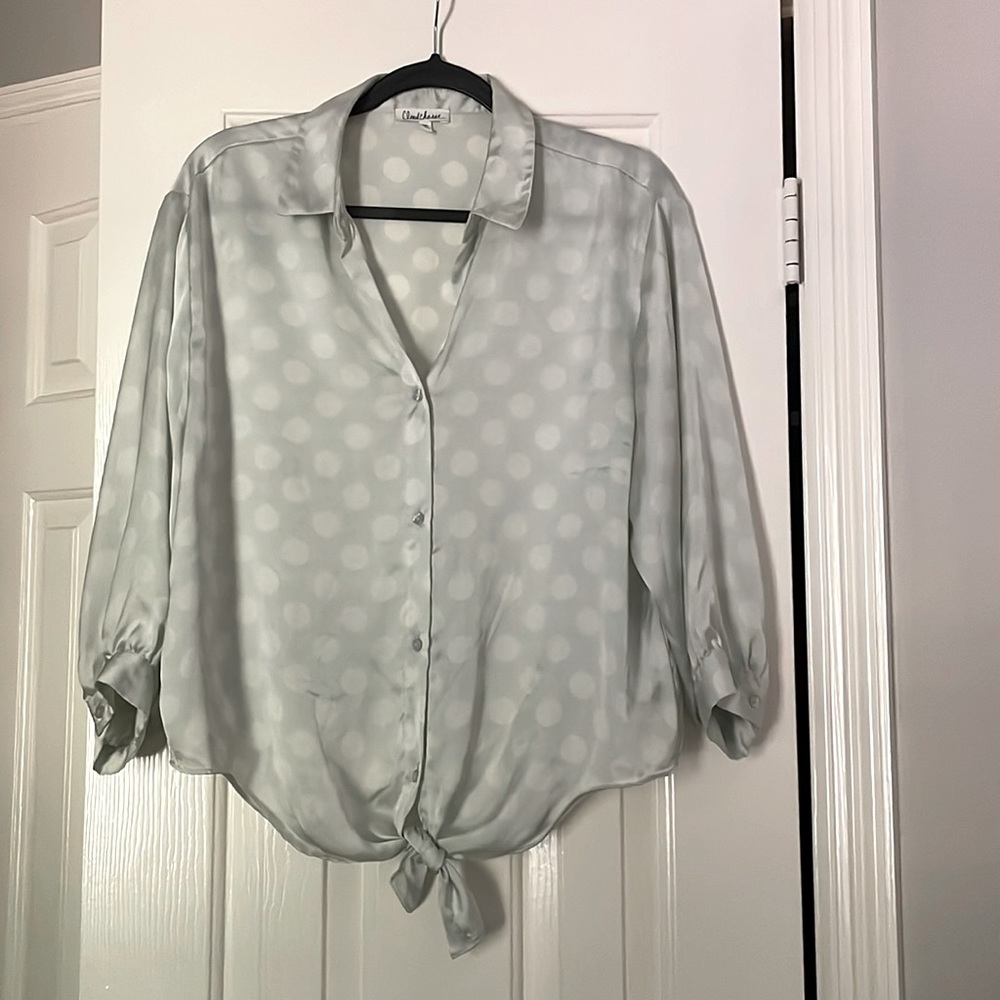 Large light green blouse tie at waist